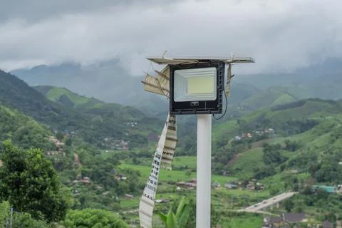 Mini solar cell panel for solar light, street light over hillside background. Stock Photos