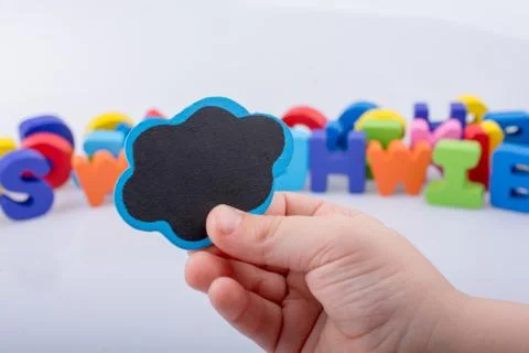 Mini speech bubble made of wood in hand Foto stock