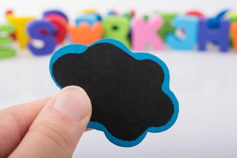 Mini speech bubble made of wood in hand Foto stock