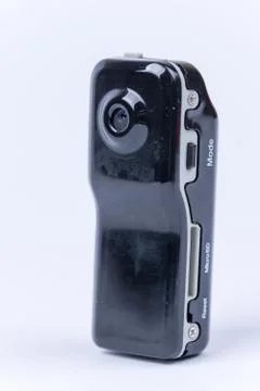 Mini spy hidden camera over white background Foto stock