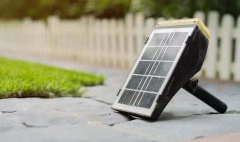 Mini-stand electric solar cell in garden with copy space. Solar panels in h.. Foto stock