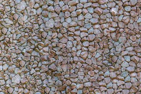 Mini stones gray light pattern hard base wall panel uneven base set of cobble Foto stock