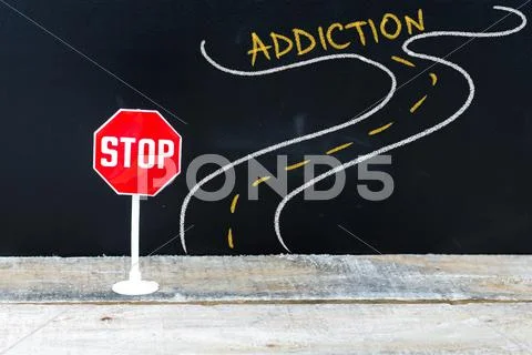 Mini STOP sign on the road to ADDICTION Stock Photos