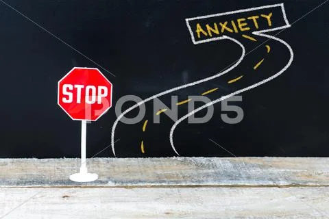 Mini STOP sign on the road to ANXIETY Stock Photos