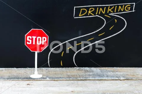 Mini STOP sign on the road to DRINKING Stock Photos