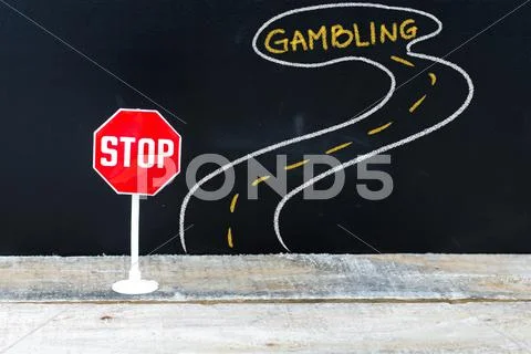 Mini STOP sign on the road to GAMBLING Stock Photos