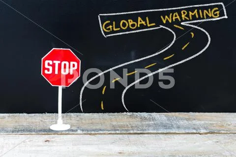 Mini STOP sign on the road to GLOBAL WARMING Stock Photos