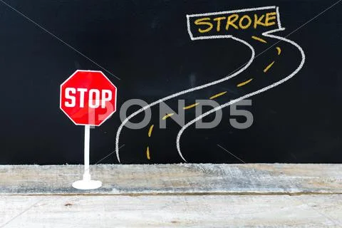 Mini STOP sign on the road to STROKE Stock Photos