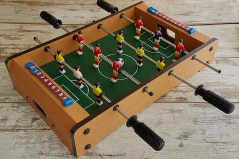 Mini table football on the table, table football on a wooden table, table spo Stock Photos