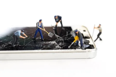 Mini technicians repairing broken screen phones caused by falling, Smartphone Stock Photos