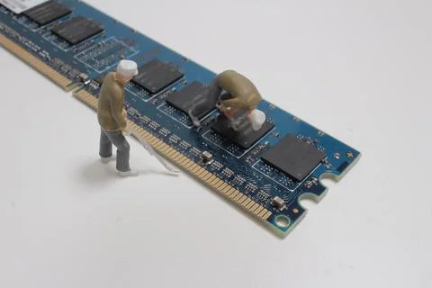 Mini technicians repairing computer RAM module. Macro photo Stock-Fotos