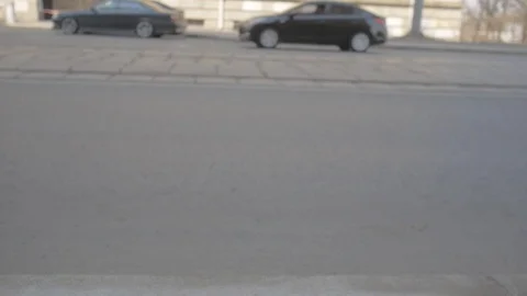 Mini tractor vacuum cleaner cleans the road, drives past the camera Video stock 97523779