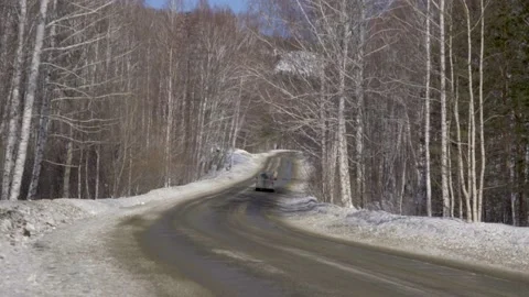 Mini van in Snowy Winter Road Stock Footage 221183865
