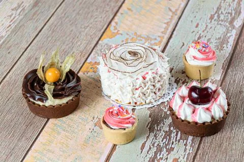 Mini vanilla cake decorated with dried coconut chips and whipped cream. Next Stock Photos