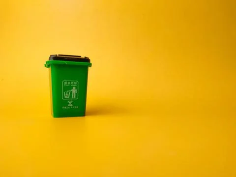 Mini Waste Bin on a yellow background Stock Photos