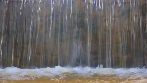Mini waterfall with a gentle flow of water and clear Stock Footage 234750917