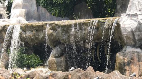 Mini waterfall in the park Stock Photos