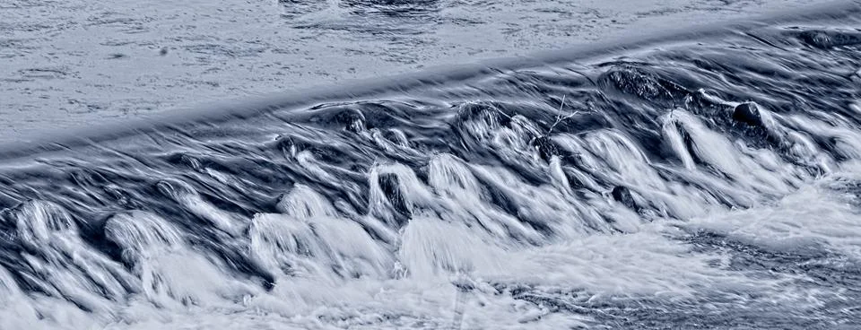 Mini waterfall on the river Stock Photos