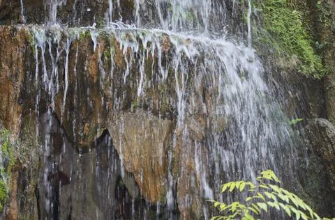 Mini waterfall. Small garden in the area of the house. Foto stock