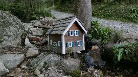 Mini watermill on a walking path in a forest of Sankt Radegund near Graz Stock Photos