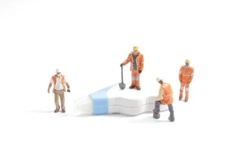 A mini worker with the Error correction belt Stock Photos
