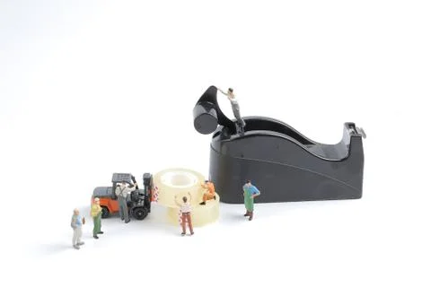 Mini of worker replace the tape for dispenser Stock Photos