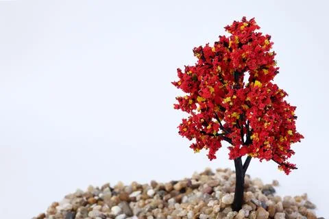 Miniature artificial tree used in model sets on a white background.  Stock Photos