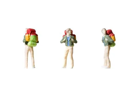 Miniature backpacker isolated on white background Foto stock