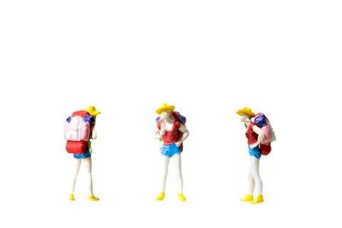 Miniature backpacker isolated on white background Stock Photos