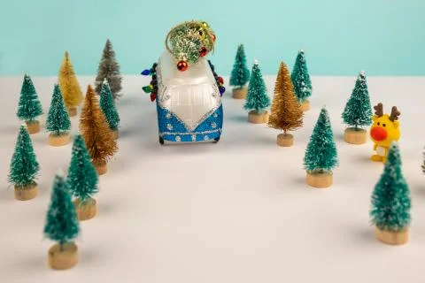 Miniature blue van with x-mas tree on is top. Stock Photos