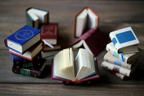 Miniature books with open pages Stock Photos