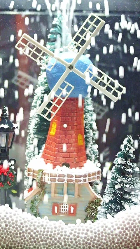Miniature Brick Windmill with Artificial Snow falling down Stock Footage 297411670