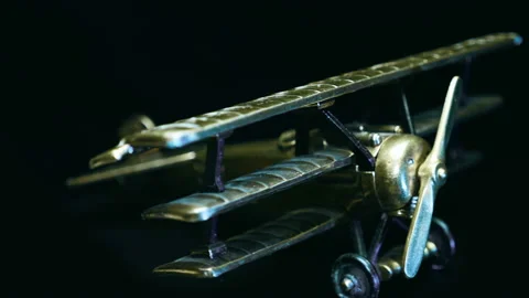 Miniature a bronze old triplane with a fascist cross on board rotates Stock Footage 121588351