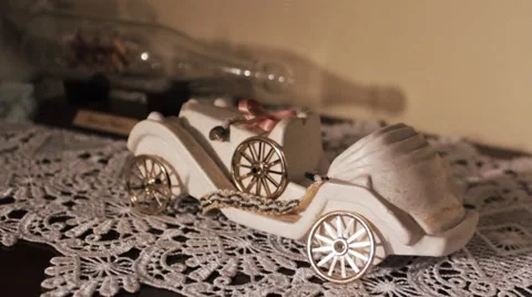 Miniature car and  record player  on camera moving and professional light Stock Footage 61915385