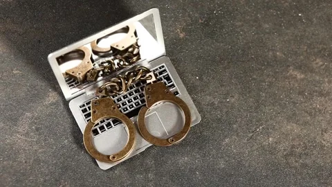 Miniature computer handcuffs Stock Footage 281440446