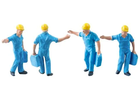 Miniature construction worker in a blue uniform isolate on white background.. Foto stock