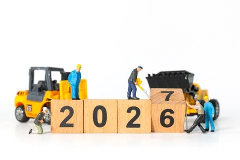 Miniature Construction Workers Changing 2026 to 2027 with Wooden Blocks and.. Stock Photos