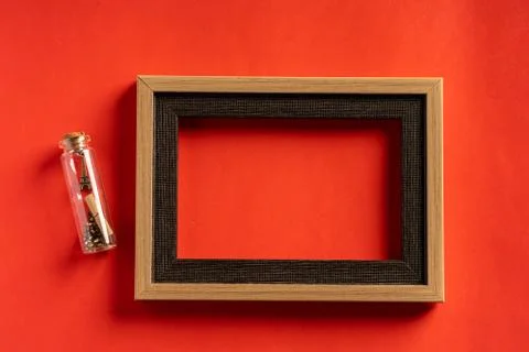 Miniature eiffel tower in bottle and empty frame Stock Photos