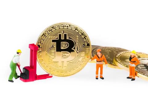 Miniature engineer and worker are mining and transferring Bitcoin activity Photos