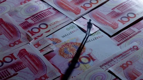Miniature Figure Standing on Scattered Red Banknotes, Macro Shot Vídeos de archivo 339067400