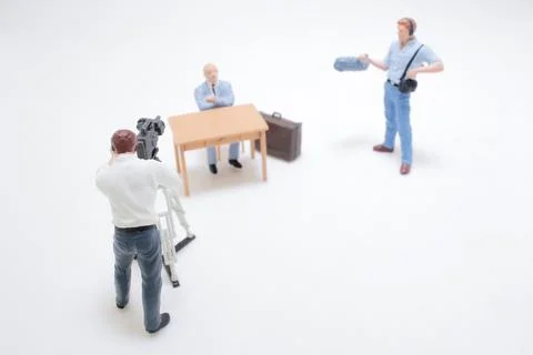 Miniature Figures Filming an Interview with Professional Equipment Stock Photos