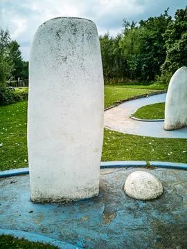 Miniature golf course obstacles with white standing stones and blue borders Stock Photos