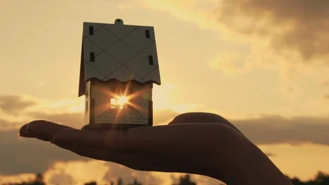 Miniature house model in hand, close-up Stock Footage 116723814