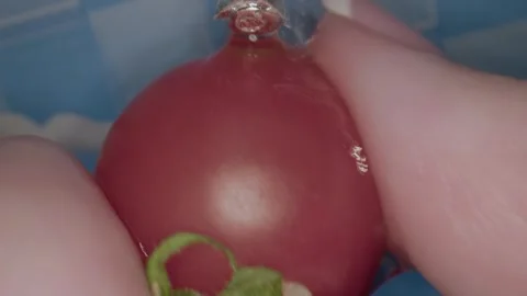 In a miniature kitchen a chef skillfully prepares food using tiny cookware and Video stock 286894031