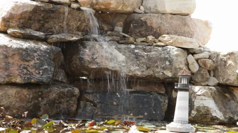 Miniature Lighthouse and Waterfall Stock Footage 40807254