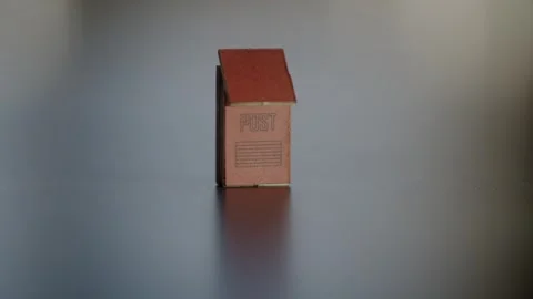 Miniature Mailbox mid frame push in to in focus empty area for text Stock Footage 272430145