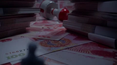 Miniature Man Standing on Stacks of Chinese Yuan Banknotes Near Stamp Stock-Footage 339068732