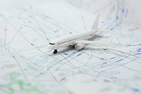 Miniature model airplane on a flight sectional map with focus on the foreground 写真素材