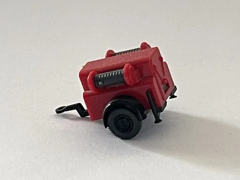 Miniature model of a construction site compressor Stockfoto's