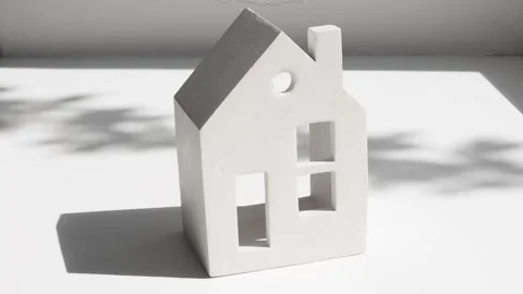 Miniature model of a house on a gray background Stock Footage 196114784